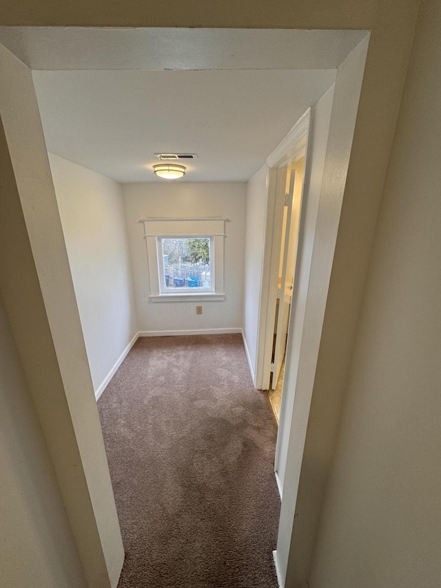 corridor featuring carpet floors