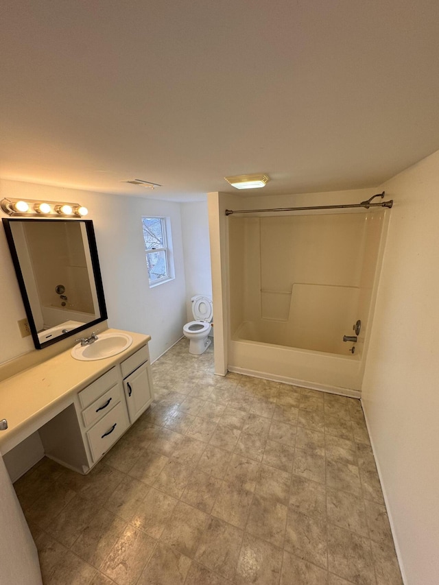 full bathroom with vanity, tub / shower combination, and toilet