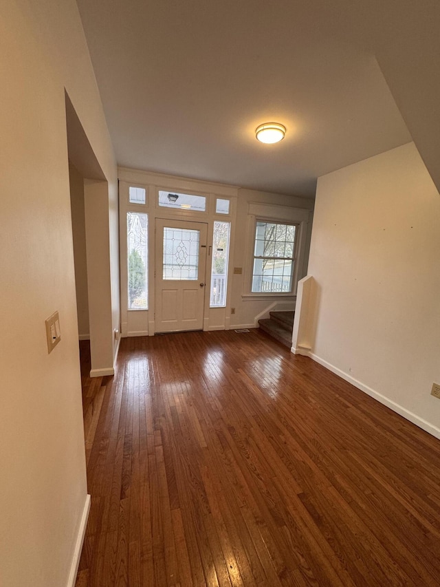 entrance foyer featuring dark hardwood / wood-style floors