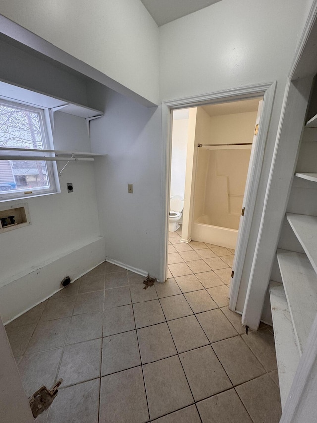 laundry room featuring washer hookup, light tile patterned floors, and electric dryer hookup