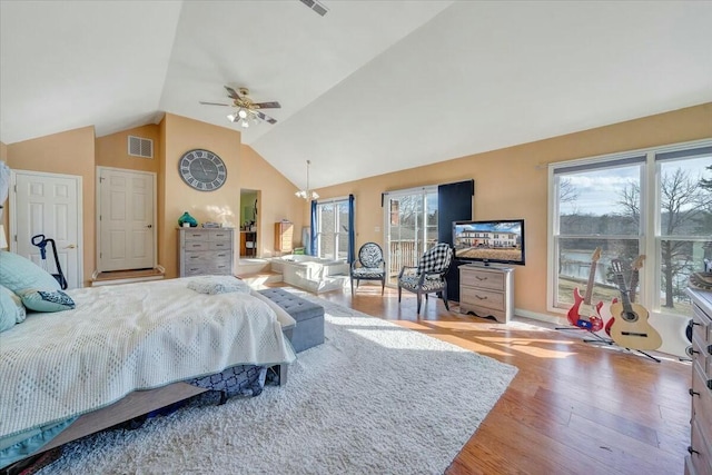 bedroom with ceiling fan, high vaulted ceiling, access to outside, and light wood-type flooring