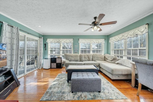 sunroom featuring plenty of natural light and ceiling fan