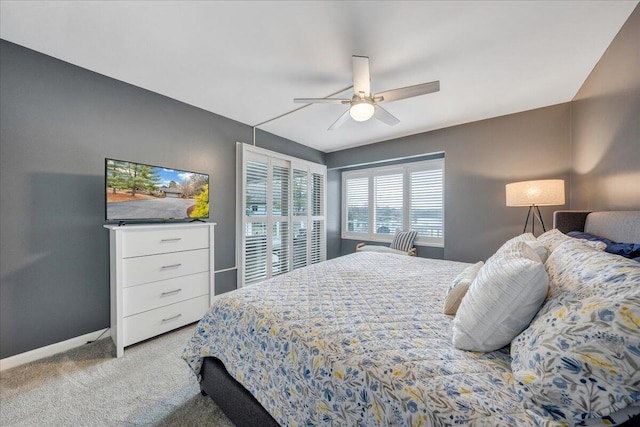 bedroom featuring ceiling fan, baseboards, and carpet floors