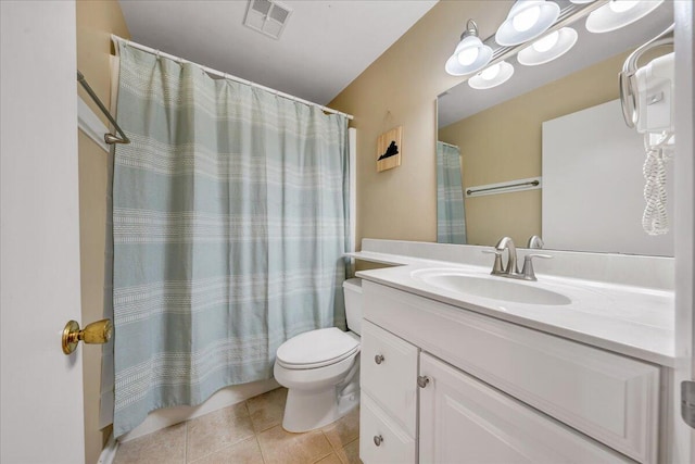 bathroom with visible vents, toilet, a shower with curtain, tile patterned floors, and vanity