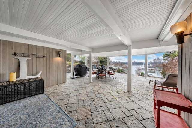 view of patio with outdoor dining space and a grill