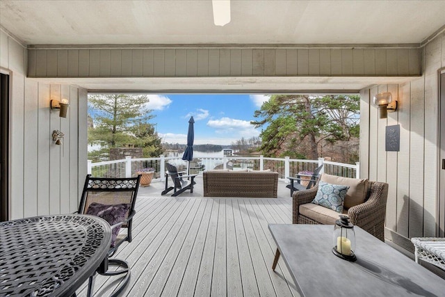 wooden terrace with outdoor lounge area