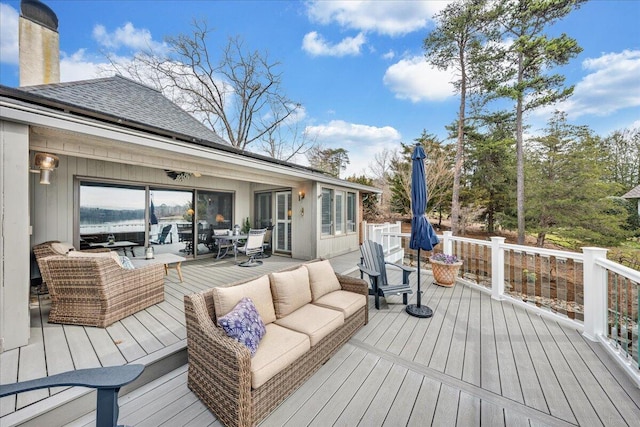 deck with outdoor dining area and outdoor lounge area