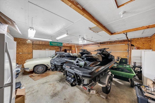 garage with freestanding refrigerator