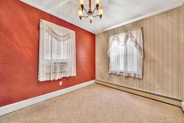 empty room with a baseboard heating unit, an inviting chandelier, and carpet flooring