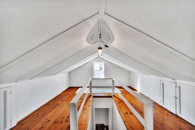 bonus room featuring lofted ceiling and light wood-type flooring