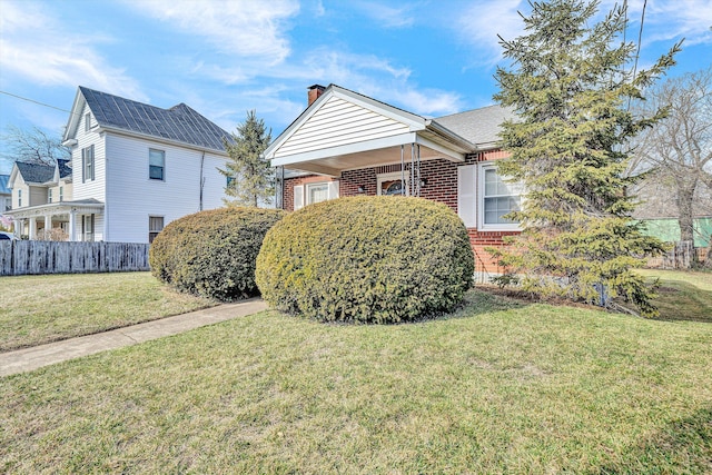 view of home's exterior with a yard