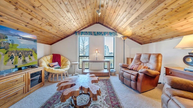 sitting room with vaulted ceiling, wooden ceiling, and light colored carpet