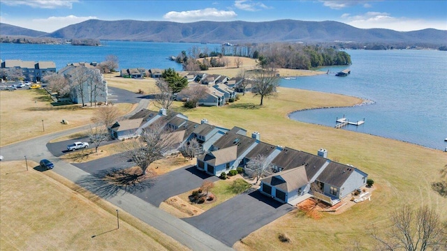 birds eye view of property featuring a water and mountain view