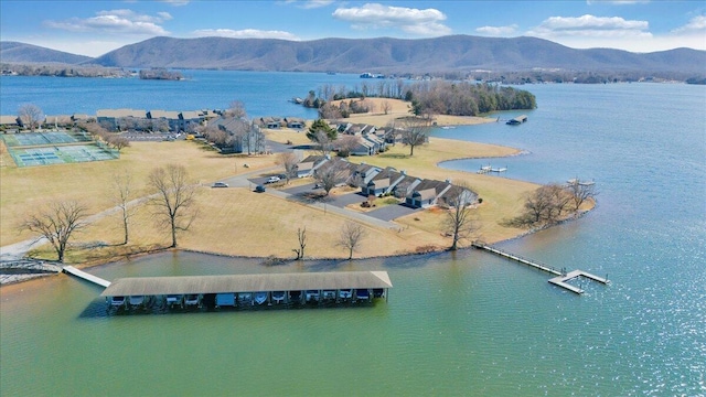 drone / aerial view featuring a water and mountain view