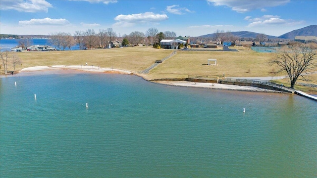 birds eye view of property featuring a water and mountain view