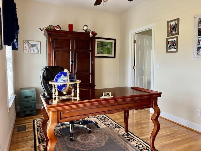 office featuring ceiling fan and light wood-type flooring