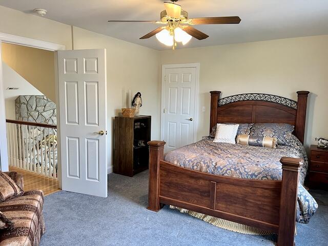 carpeted bedroom featuring ceiling fan