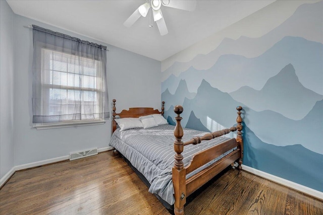 bedroom with wood-type flooring and ceiling fan