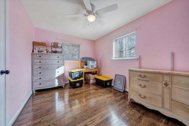 bedroom with dark hardwood / wood-style floors and ceiling fan