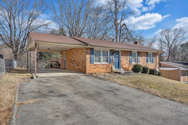 ranch-style house with a carport