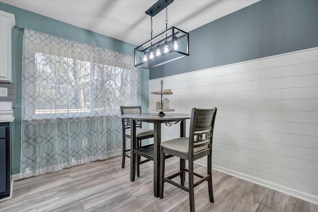 dining space featuring light wood-type flooring