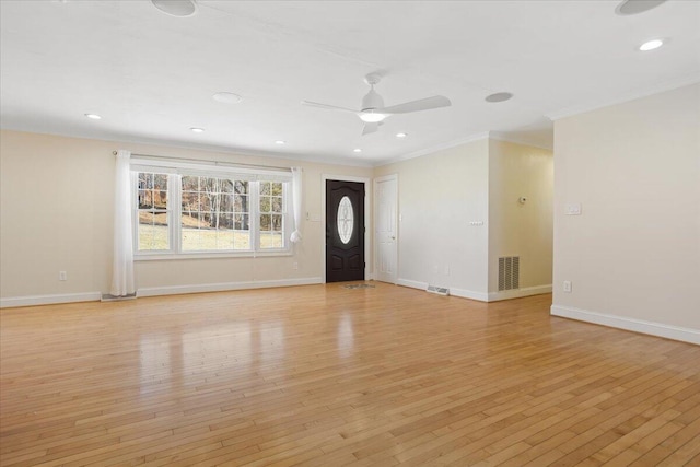 interior space featuring visible vents, light wood-style flooring, and baseboards