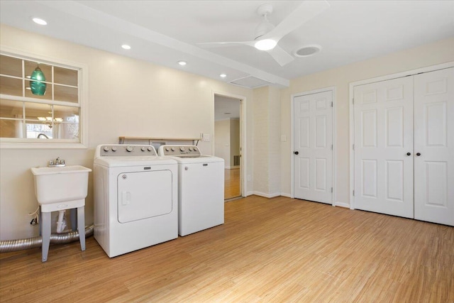 laundry area featuring laundry area, light wood-type flooring, independent washer and dryer, and recessed lighting