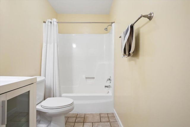 full bathroom with toilet, shower / tub combo, vanity, baseboards, and tile patterned floors