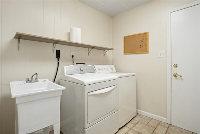 washroom featuring laundry area, a sink, and independent washer and dryer