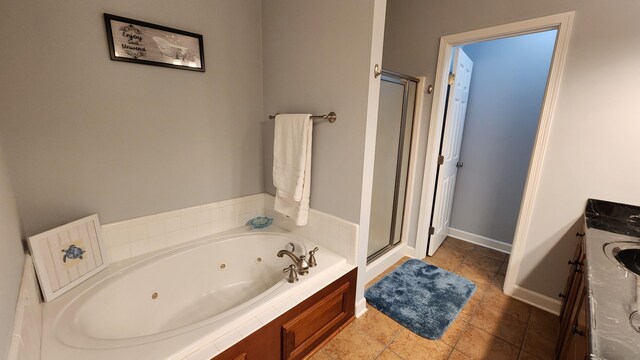1057 Barrow Hills Dr, Huddleston, VA 24104 - bathroom featuring a shower stall, a whirlpool tub, vanity, and baseboards