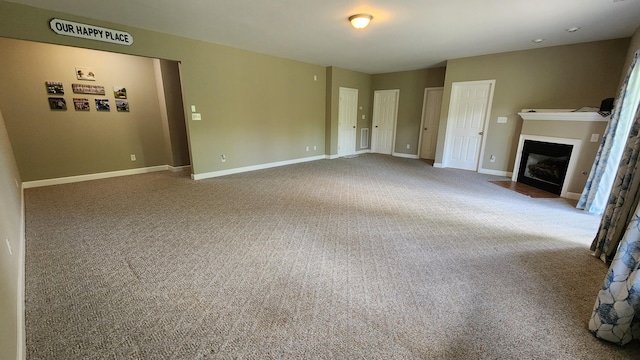 1057 Barrow Hills Dr, Huddleston, VA 24104 - unfurnished living room featuring carpet floors, a fireplace with flush hearth, and baseboards