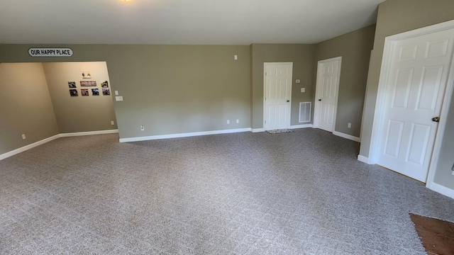 1057 Barrow Hills Dr, Huddleston, VA 24104 - unfurnished room featuring baseboards and dark carpet