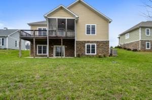 1057 Barrow Hills Dr, Huddleston, VA 24104 - back of property with a sunroom, a lawn, and a deck