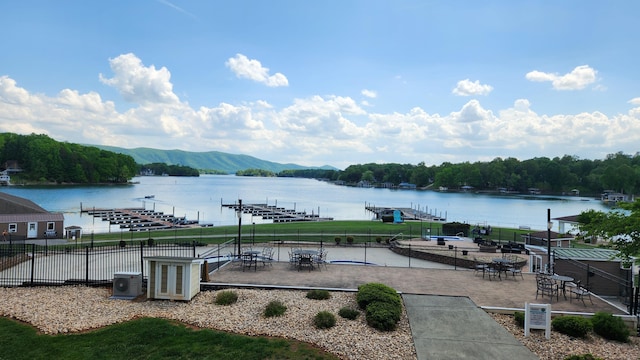 1057 Barrow Hills Dr, Huddleston, VA 24104 - water view featuring mountains, a dock, and fence