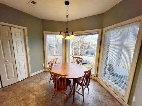 dining space with a notable chandelier and plenty of natural light