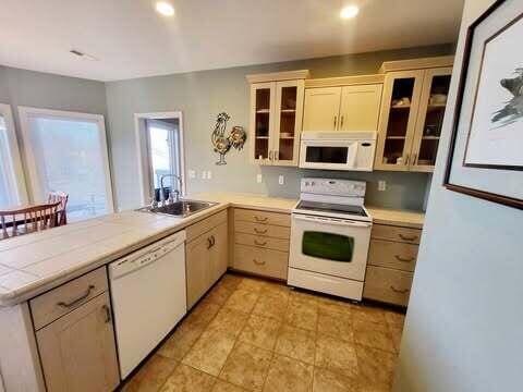 kitchen with sink and white appliances