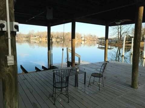 dock area with a water view and a gazebo