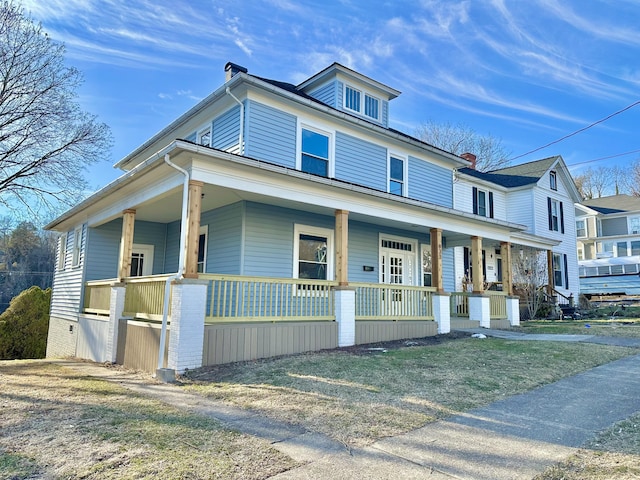 traditional style home featuring a porch