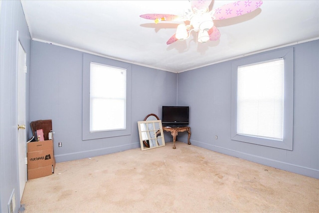 interior space featuring crown molding and ceiling fan