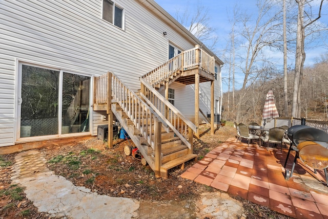 exterior space with a patio area and central air condition unit