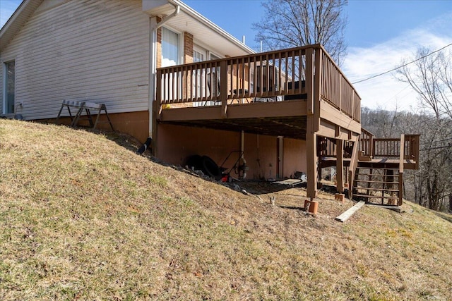 view of home's exterior with a yard and a deck