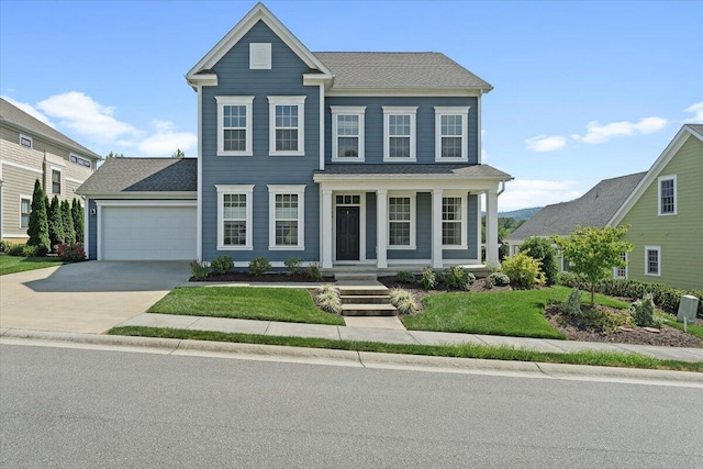 view of front of home featuring a garage and a front lawn