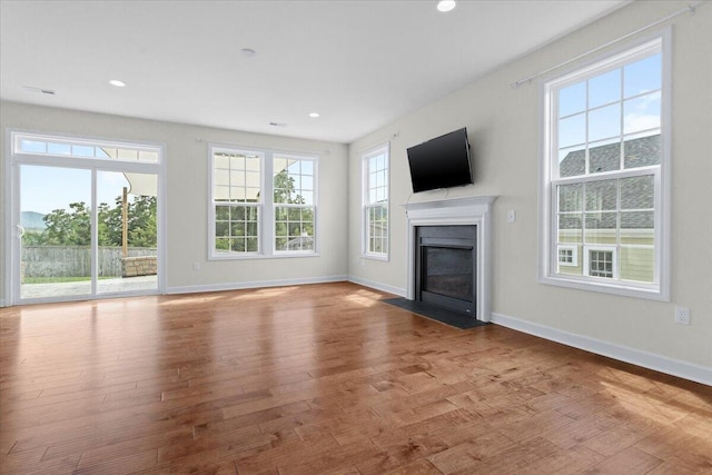 unfurnished living room with light hardwood / wood-style flooring