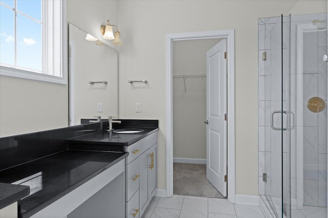 bathroom featuring vanity and walk in shower