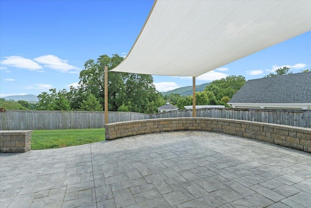 view of patio with a mountain view