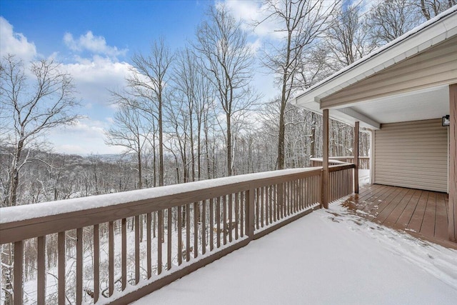 view of snow covered deck