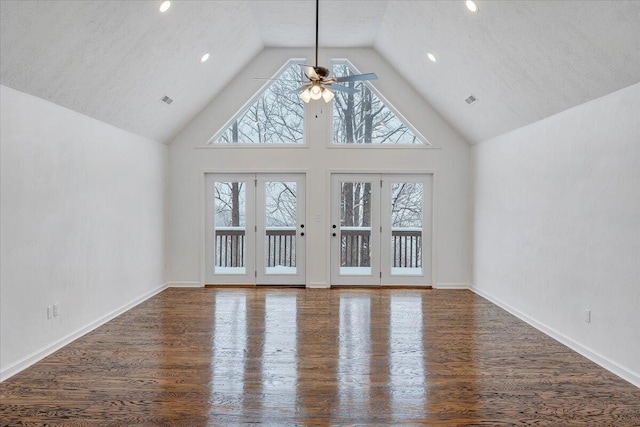 unfurnished living room featuring a textured ceiling, wood-type flooring, high vaulted ceiling, and ceiling fan