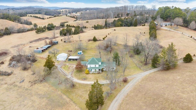 birds eye view of property with a rural view