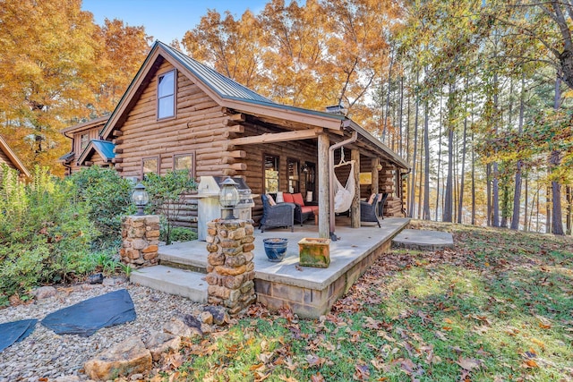 rear view of house featuring an outdoor hangout area and a patio area