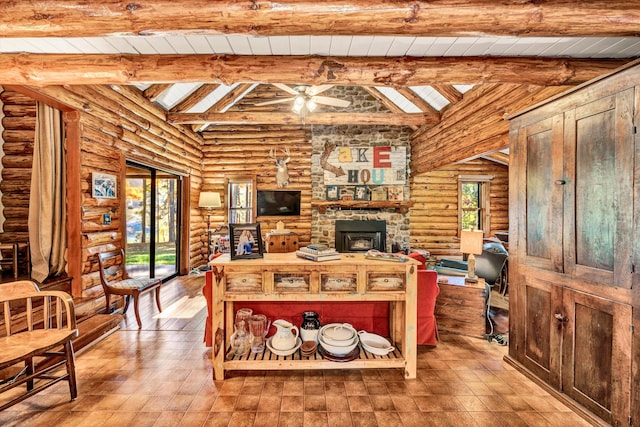 living room with ceiling fan, wooden ceiling, and vaulted ceiling with skylight